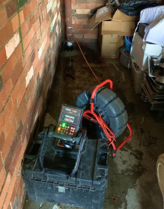 Blocked drain plumbing with the help of high pressure water jetting.